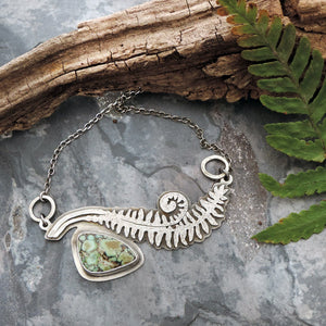 handmade unfurling fern in sterling silver