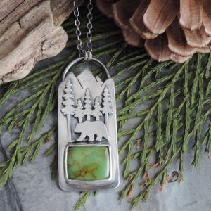 green turquoise pendant with bear in mountains
