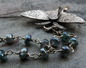 luna moth necklace with blue kyanite gemstones