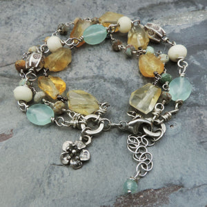 beaded gemstone bracelet with cherry blossom