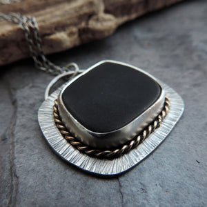 silver black and gold jewelry