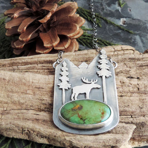 green turquoise pendant with moose in mountains