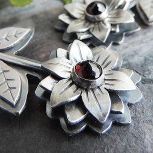 sterling silver flower earrings with garnet center