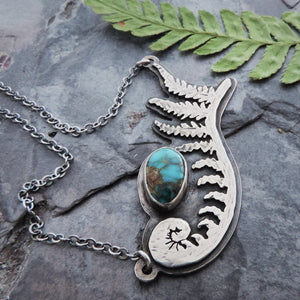 handmade unfurling fern pendant
