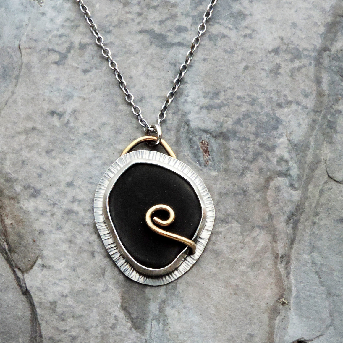 black silver and gold pendant necklace