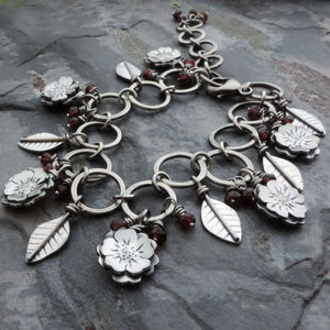 Flower Garden Charm Bracelet Accented with Red Garnet