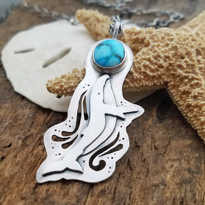 playful whale pendant with turquoise stone