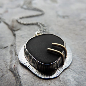 silver black and gold pendant necklace