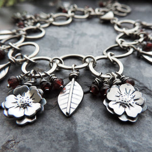 Flower Garden Charm Bracelet Accented with Red Garnet