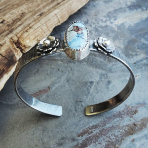 silver cuff with flowers and turquoise