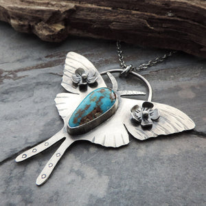 luna moth pendant with flowers and turquoise