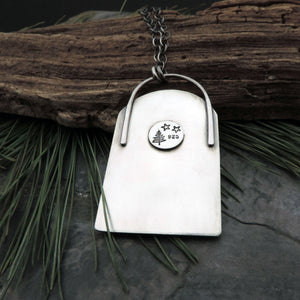Moon Face Over Mountains and Pine Trees Necklace