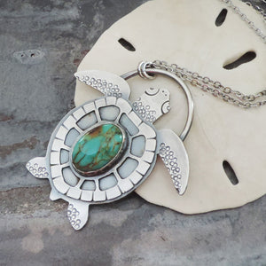 sea turtle necklace with turquoise gemstone