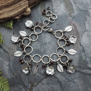 Flower Garden Charm Bracelet Accented with Red Garnet