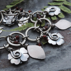 Flower Garden Charm Bracelet Accented with Red Garnet