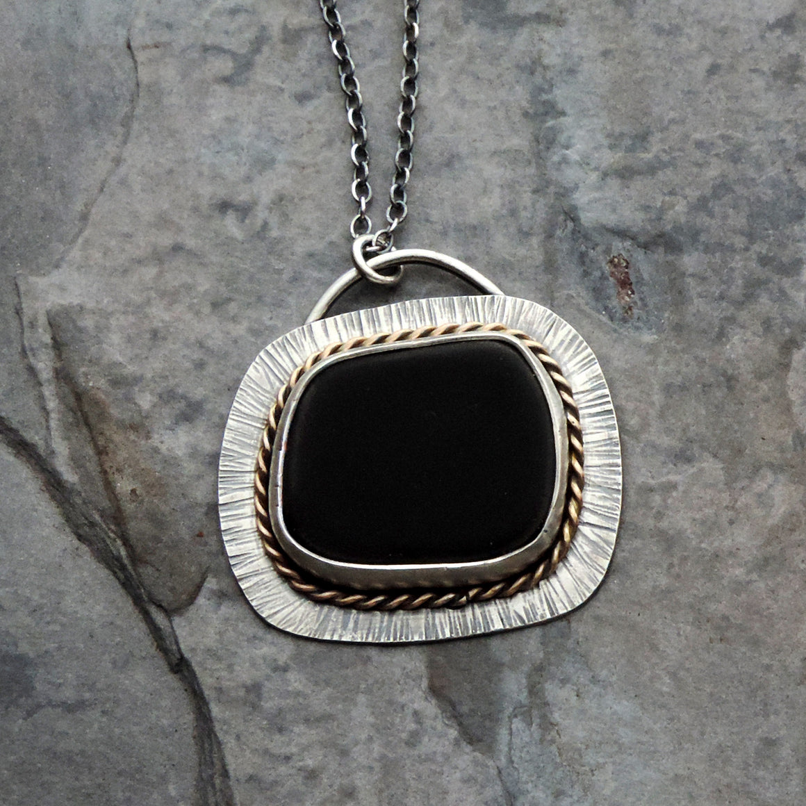 black beach stone sterling silver gold pendant