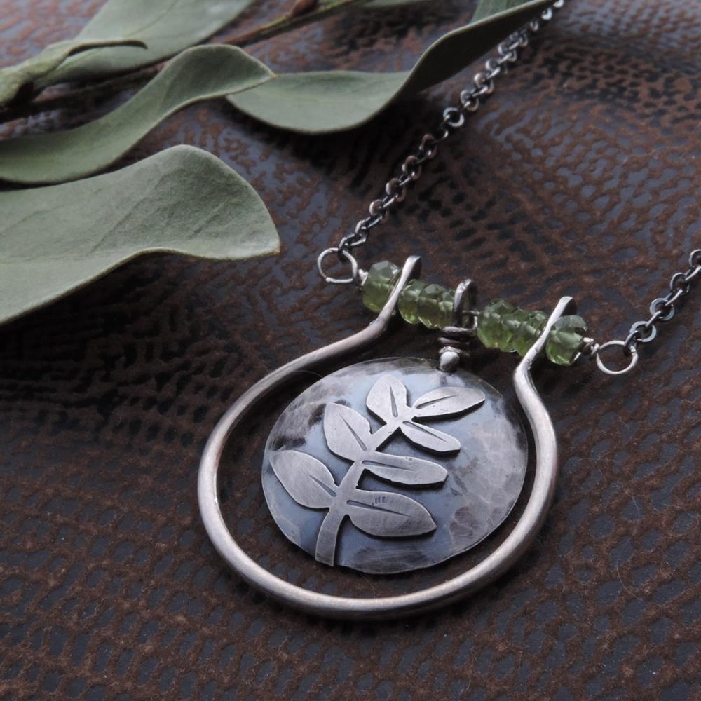 sterling silver fern leaf necklace with green peridot gemstones
